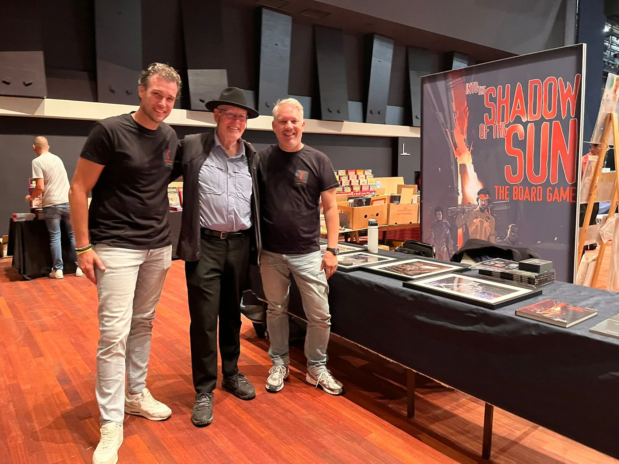 Thovos Games creators together with a collaborator at a game event